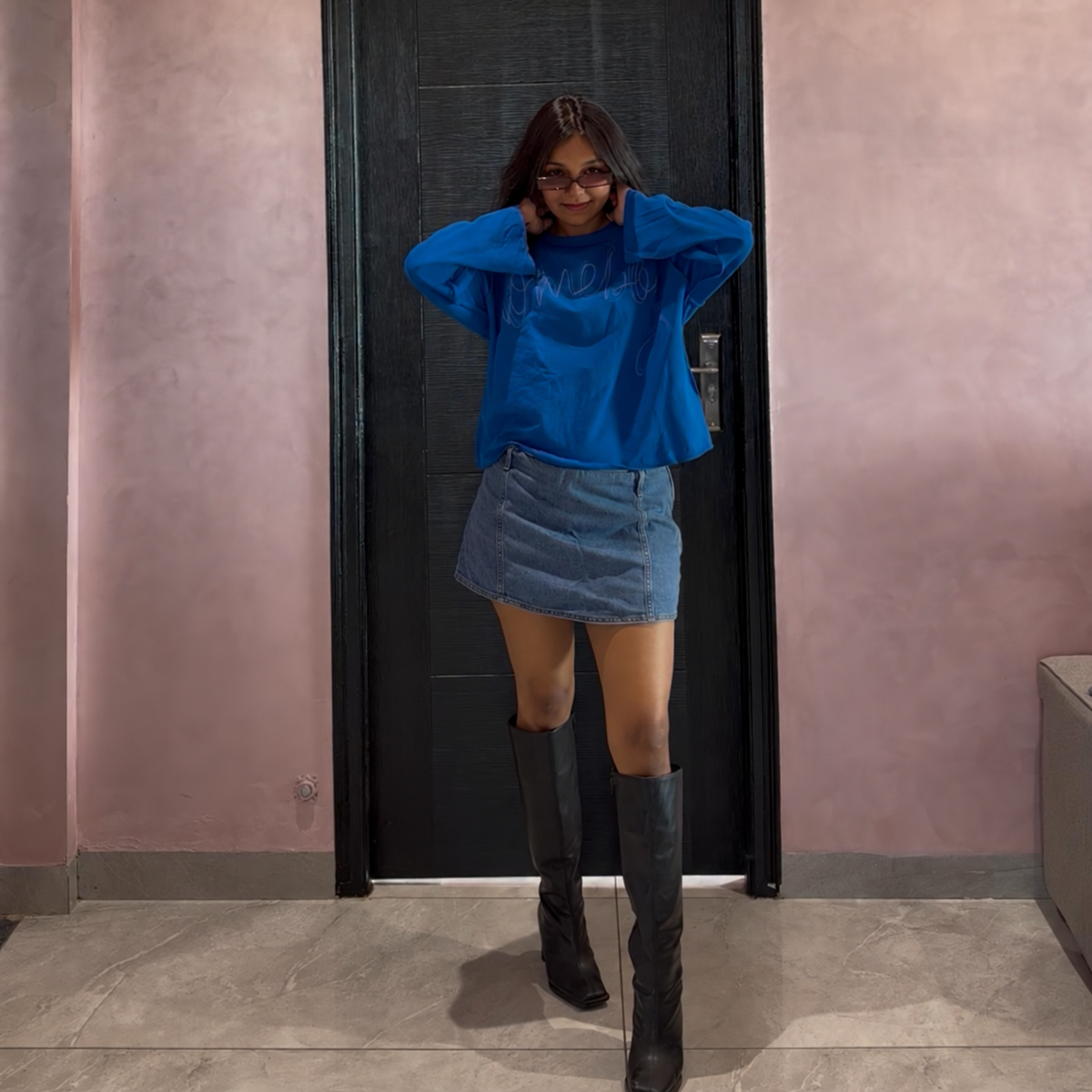 Bloomed blue long sleeve T-shirt styled with a denim skirt and black boots